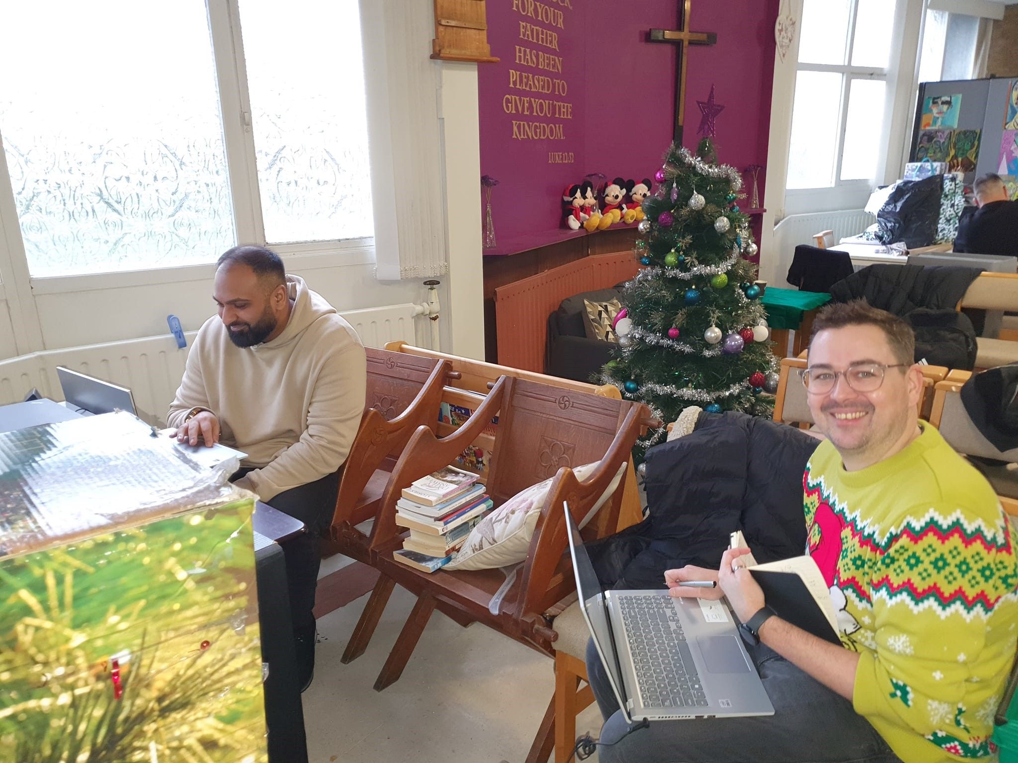 Two members of Avove's Business Technology Group team volunteering for the community hub, The Chatterbox Project.