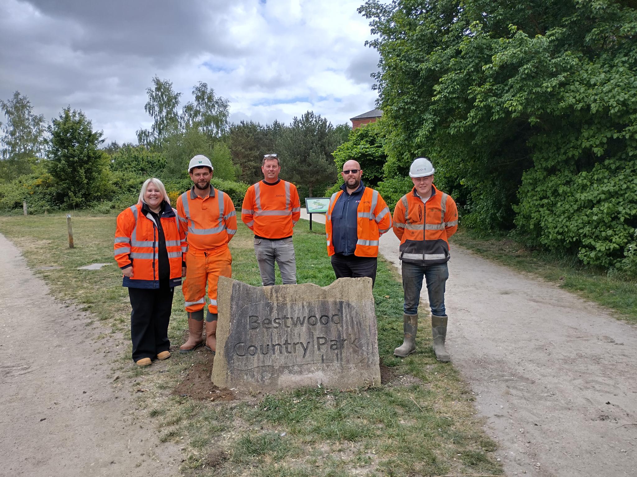 Team from Avove Strelley to Redhill project and Waitings work together at Bestwood Park to install welcome sign