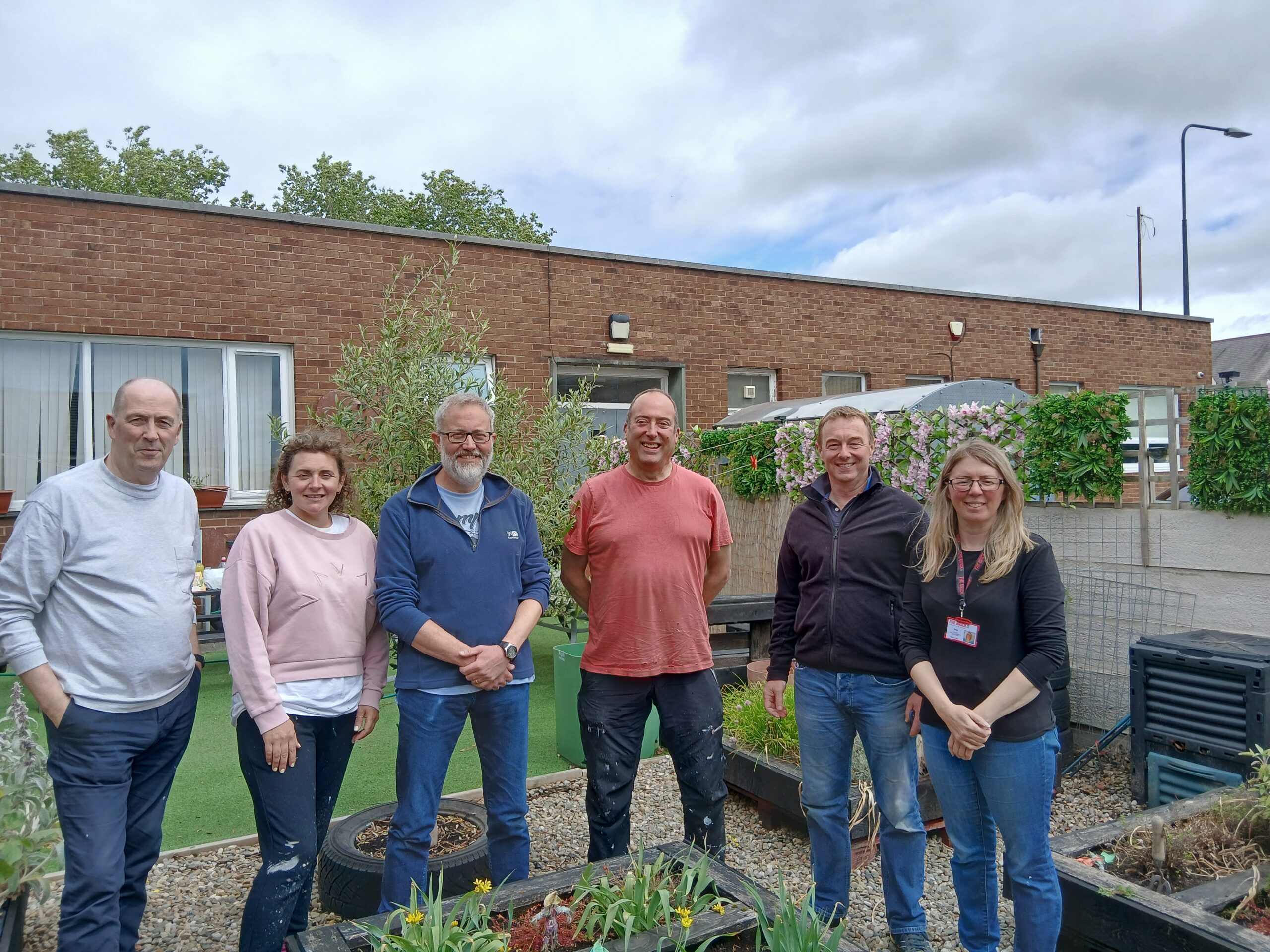 Avove's Executive Leadership Team with The Brick's Volunteer Engagement Coordinator, Rose Corns.